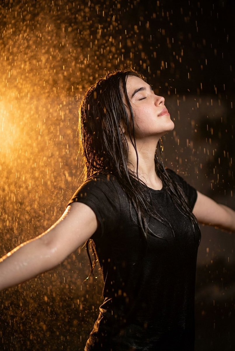 Preview image for Cinematic portrait of woman in heavy rain at night prompt