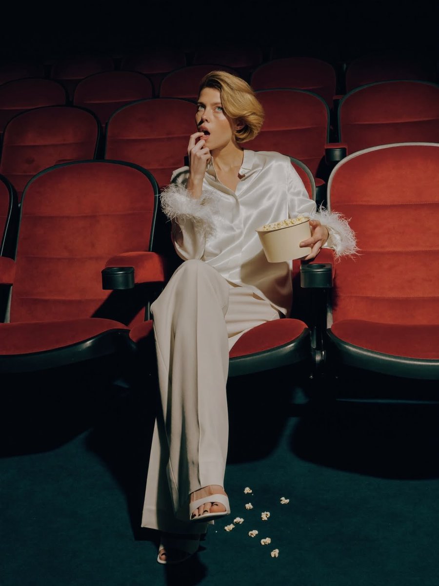 Elegant Fashion Editorial in a Dark Movie Theater - AI Art AI Generated Artwork